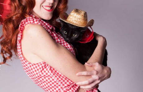 Girl and cat cowboy hat
